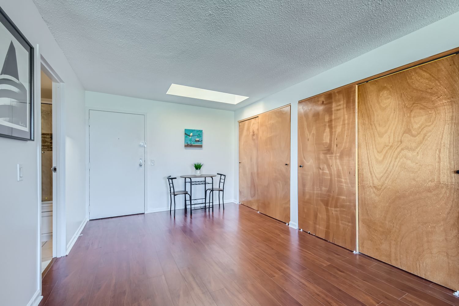 711 West Gordon Terrace, Unit 701 Chicago, IL 60613 - Photo 18 of 27 a view of a room with wooden floor and a window