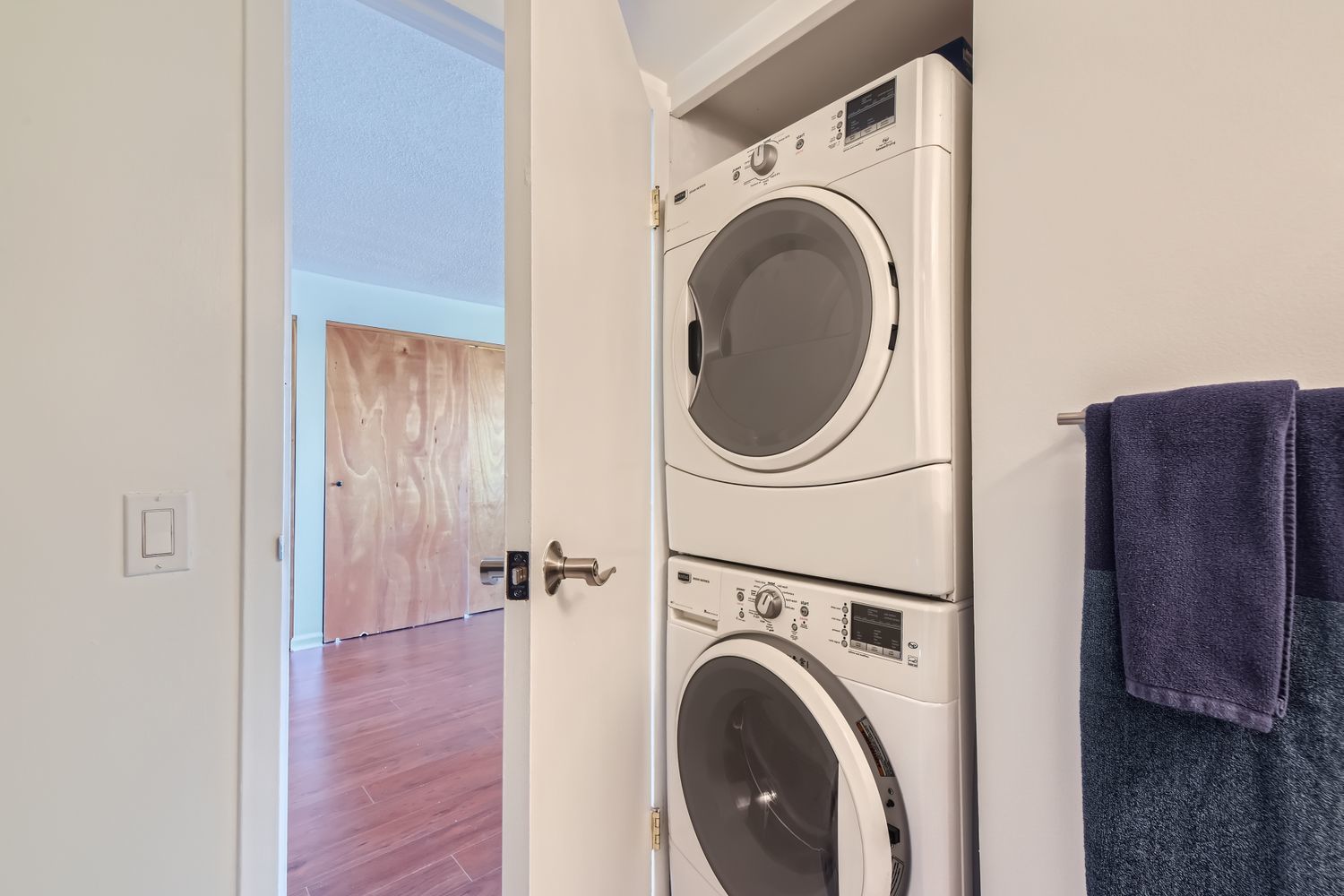 711 West Gordon Terrace, Unit 701 Chicago, IL 60613 - Photo 23 of 27 a view of a hallway with washer and dryer