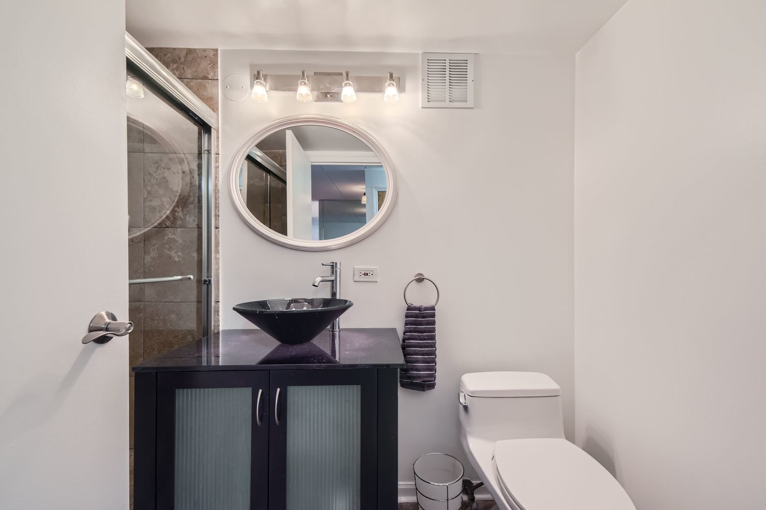 711 West Gordon Terrace, Unit 701 Chicago, IL 60613 - Photo 24 of 27 a bathroom with a toilet and a sink