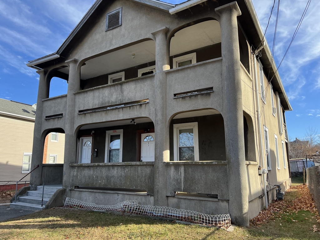 75-77 Healey Street Springfield, MA 01151 - Photo 2 of 28 a view of a building with many windows