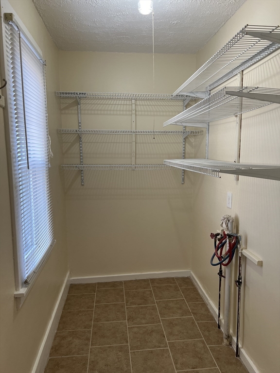 75-77 Healey Street Springfield, MA 01151 - Photo 9 of 28 a view of a room with racks on the wall