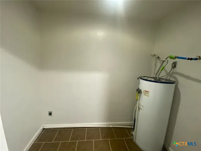 a view of backyard with green space and seating