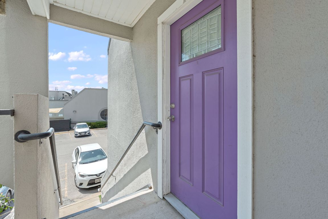 935 La Posada Drive, Unit 254 Austin, TX 78752 - Photo 18 of 19 Entrance to property with stucco siding