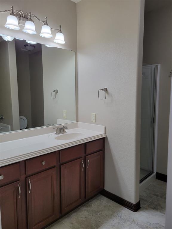 1633 Kawati Way Krum, TX 76249 - Photo 13 of 17 a bathroom with a sink and a mirror