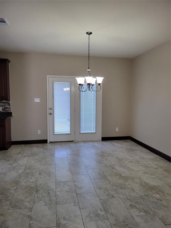 1633 Kawati Way Krum, TX 76249 - Photo 6 of 17 a view of a kitchen with a sink and chandelier