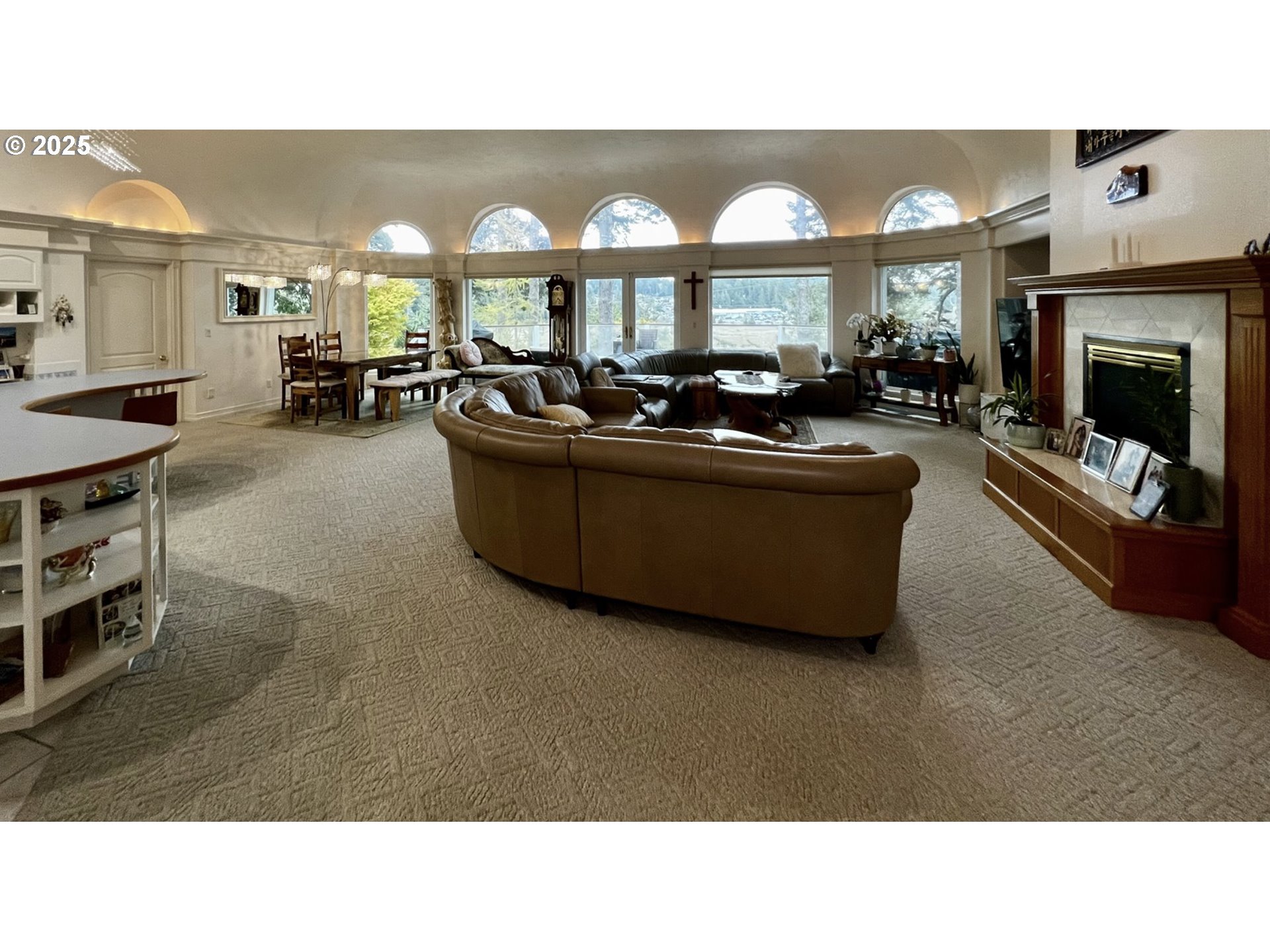 2719 Alder Ridge Drive North Bend, OR 97459 - Photo 13 of 27 a living room with furniture a window and a fireplace