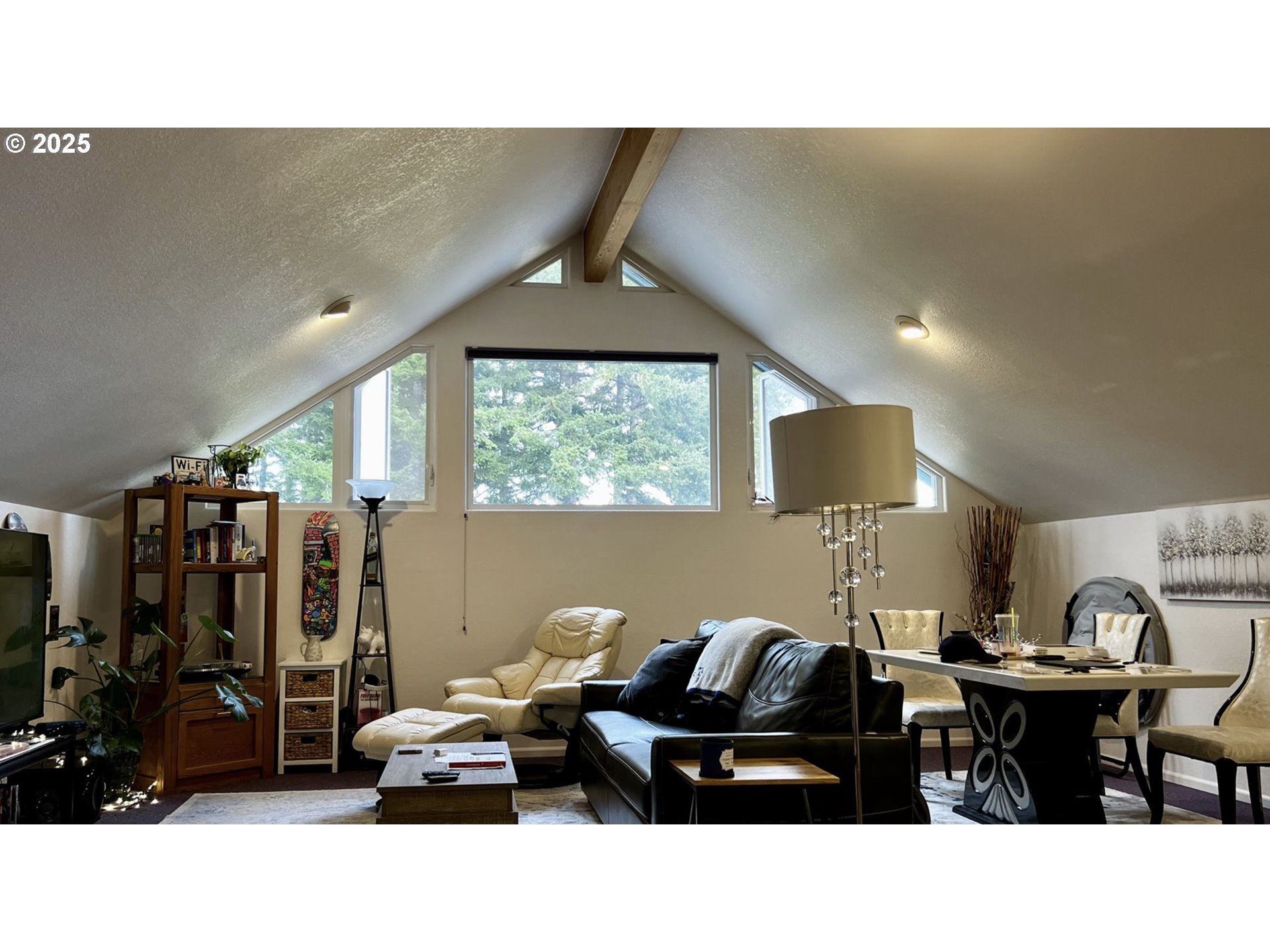 2719 Alder Ridge Drive North Bend, OR 97459 - Photo 20 of 27 a living room with furniture a window and a flat screen tv