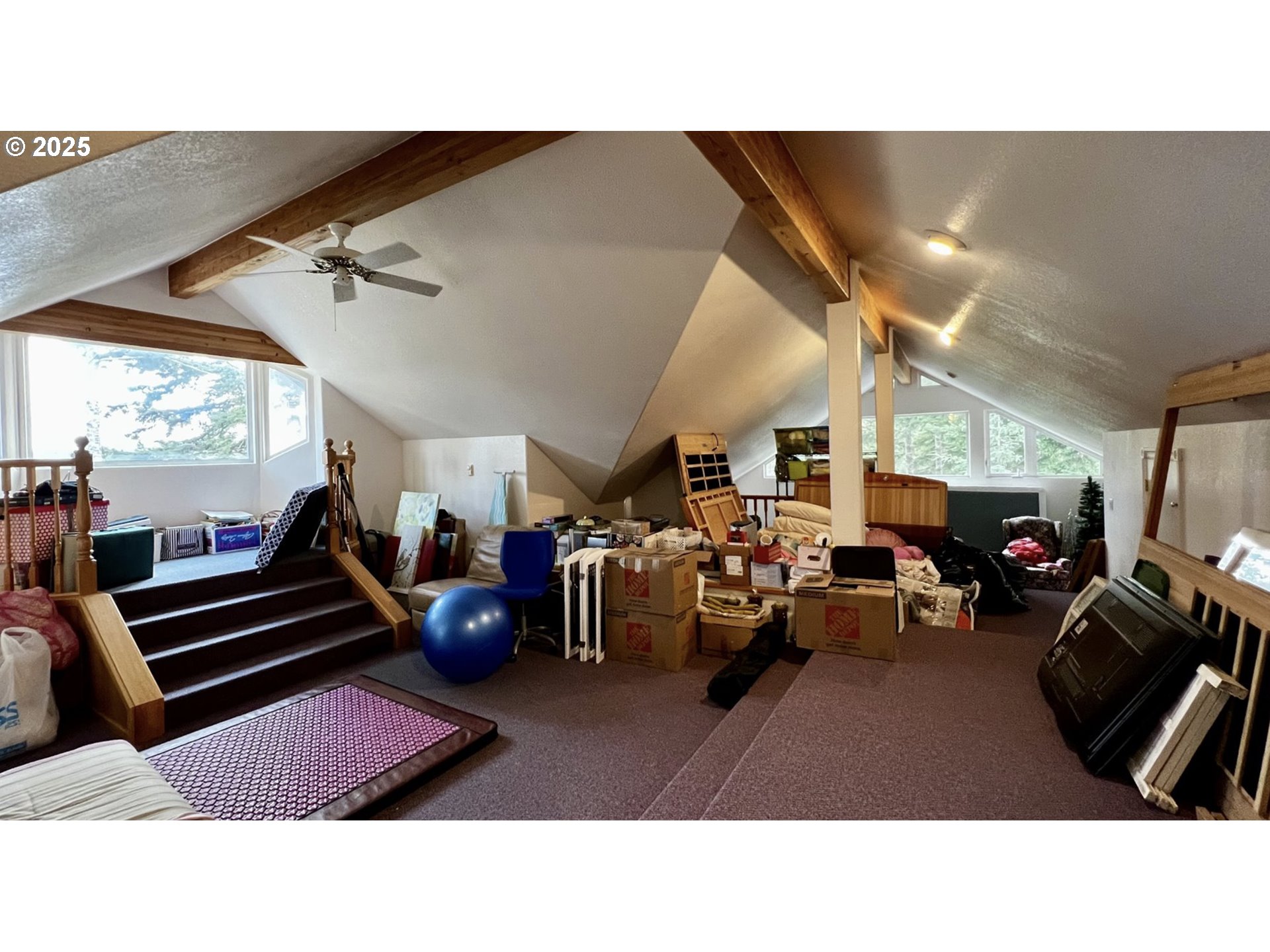 2719 Alder Ridge Drive North Bend, OR 97459 - Photo 21 of 27 a living room with lots of furniture and windows