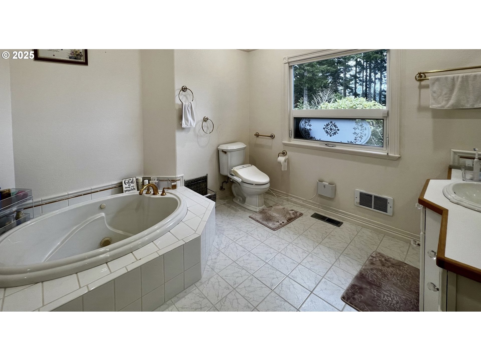 2719 Alder Ridge Drive North Bend, OR 97459 - Photo 25 of 27 a bathroom with a sink mirror and toilet