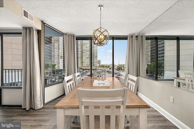 a very nice looking room with a large window and chandelier