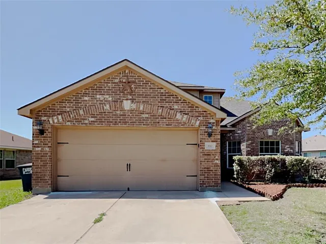 a view of a house with a garage