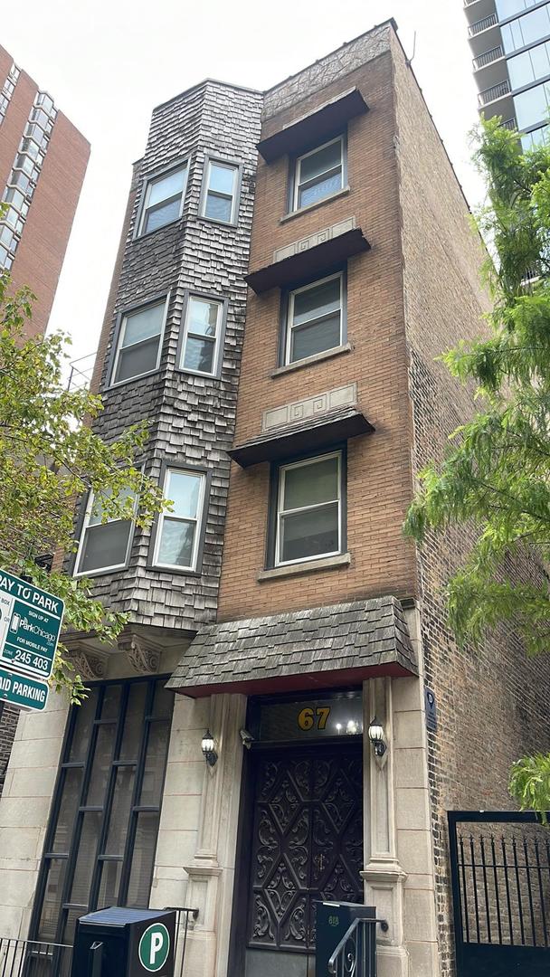 67 West Chestnut Street, Unit 4 Chicago, IL 60610 - Photo 1 of 13 a view of a building with a window