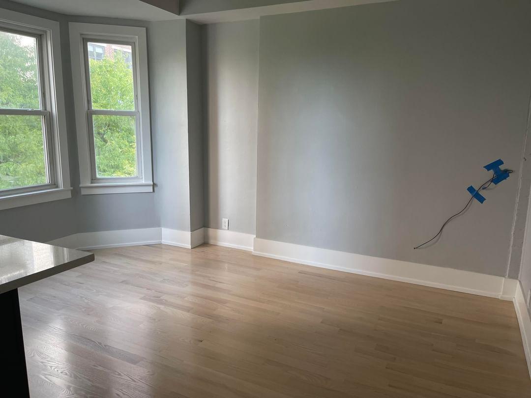 67 West Chestnut Street, Unit 4 Chicago, IL 60610 - Photo 5 of 13 an empty room with windows