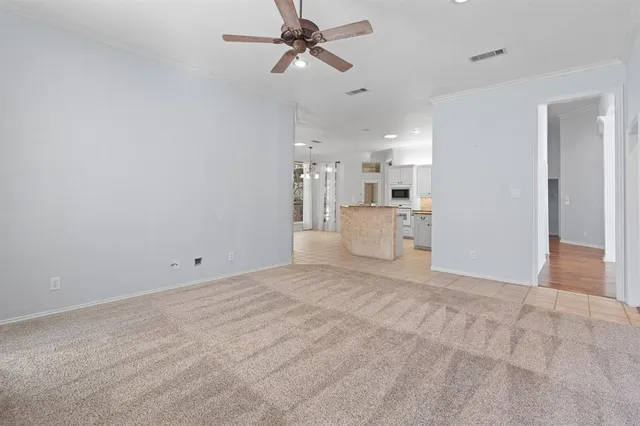 a view of a kitchen with a sink and cabinets
