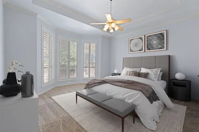 a spacious bedroom with a bed and a couch