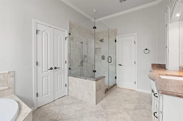a spacious bathroom with a shower and a sink
