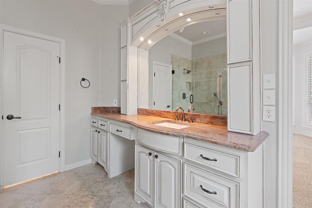 4 Brookway Court Mansfield, TX 76063 - Photo 22 of 38 a bathroom with a granite countertop sink and a mirror