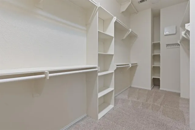 a view of an empty walk in closet
