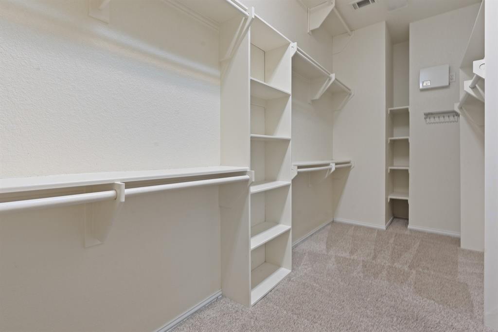 4 Brookway Court Mansfield, TX 76063 - Photo 23 of 38 a view of an empty walk in closet