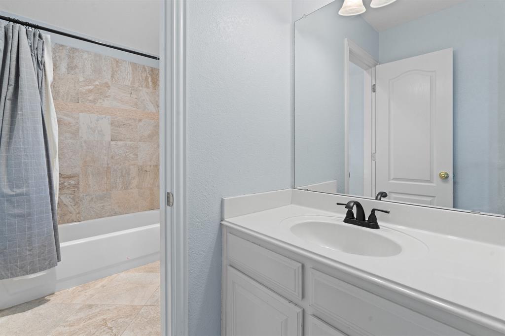 4 Brookway Court Mansfield, TX 76063 - Photo 26 of 38 a bathroom with a sink and a shower