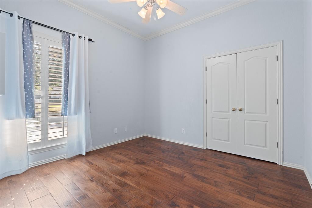 4 Brookway Court Mansfield, TX 76063 - Photo 31 of 38 a view of an empty room with a window and wooden floor