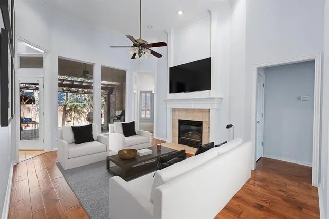 a living room with furniture fireplace and flat screen tv