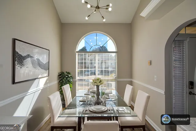 a view of a dining room with furniture window and outside view
