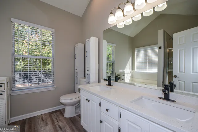 a white bath tub sitting next to a white sink