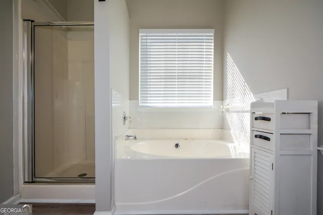 a bathroom with a toilet a sink and a mirror