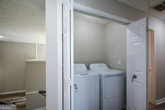 a white toilet sitting next to a shower