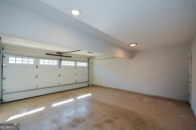 a view of a balcony with wooden fence and trees