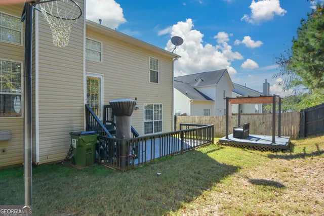 a aerial view of a house with a yard