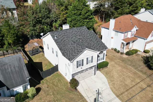 an aerial view of multiple house with yard