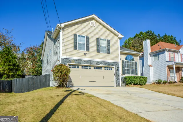 a front view of a house with a yard