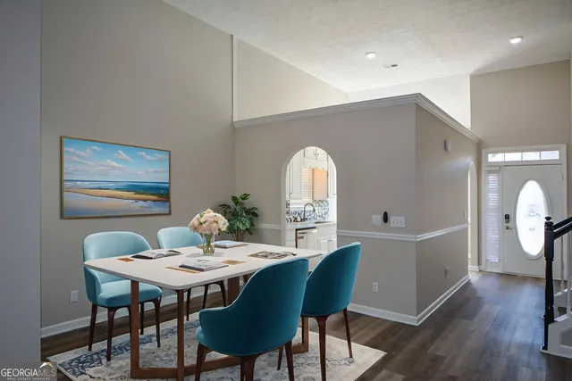 a view of a dining room with furniture window and wooden floor