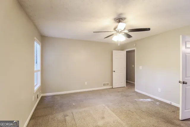 a view of a chandelier fan in a room