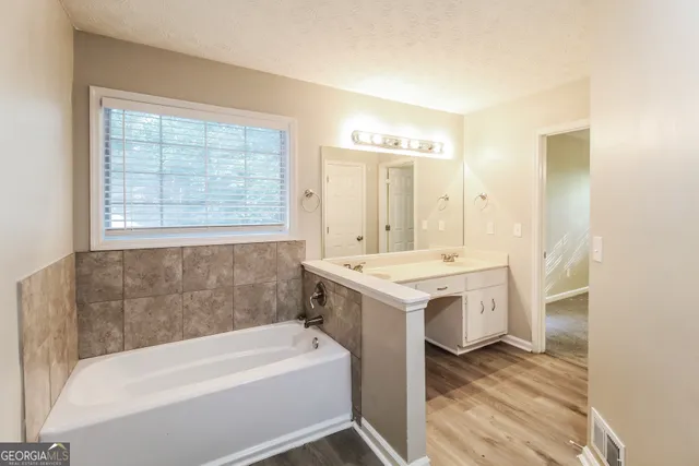 a bathroom with a sink and a bathtub