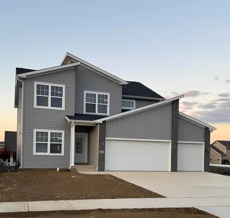 a front view of a house with a garage