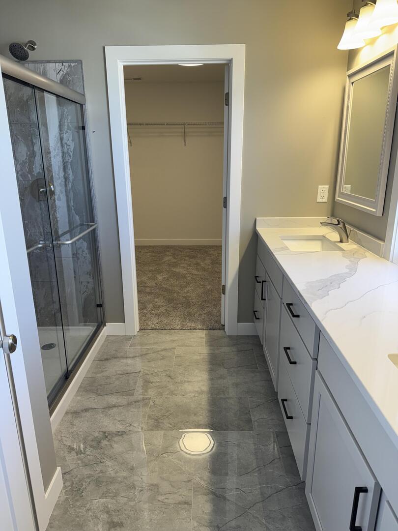 3618 Cabernet Court Normal, IL 61761 - Photo 16 of 16 a bathroom with a granite countertop sink and a mirror