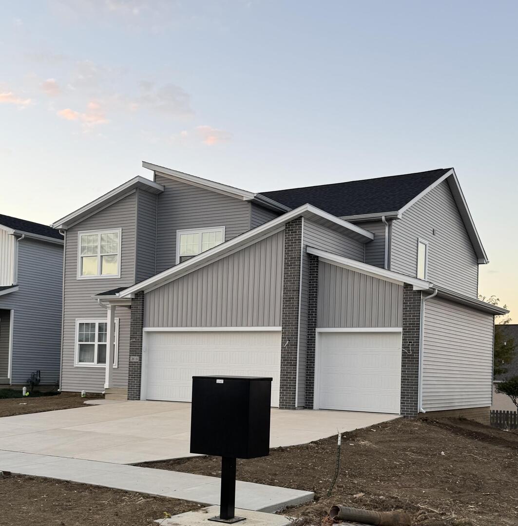 3618 Cabernet Court Normal, IL 61761 - Photo 2 of 16 a front view of a house with a yard