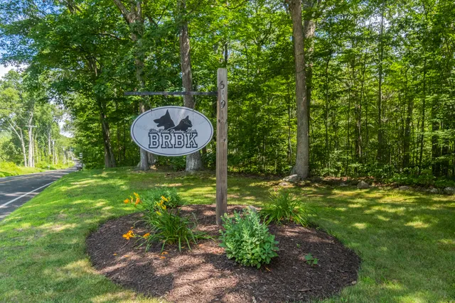 a view of a golf club with a backyard