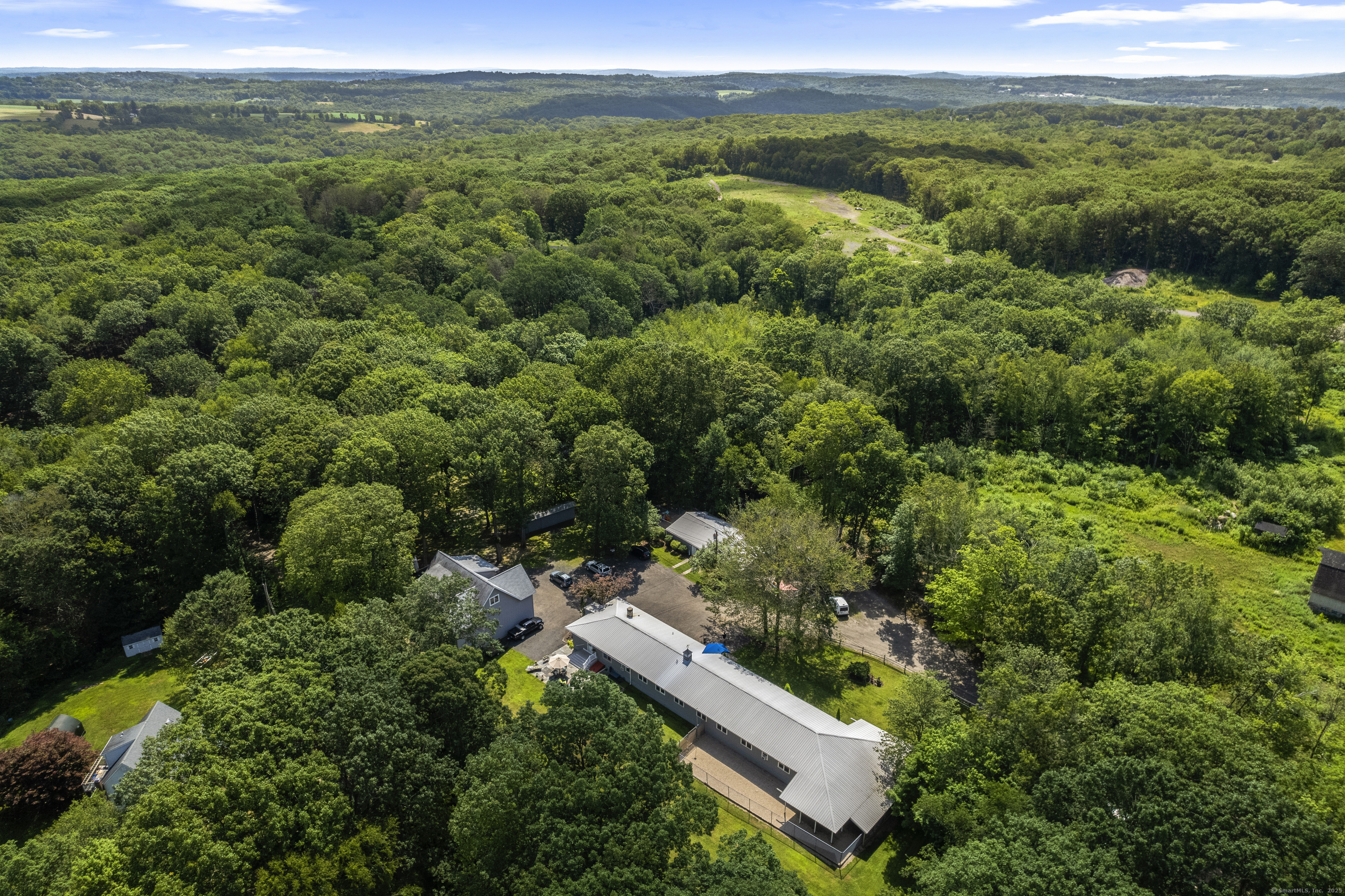 319 Main Street South Bethlehem, CT 06751 - Photo 2 of 33 an aerial view of a house with a yard