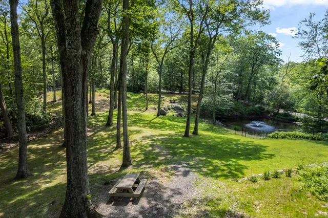 a view of a chairs and table in patio