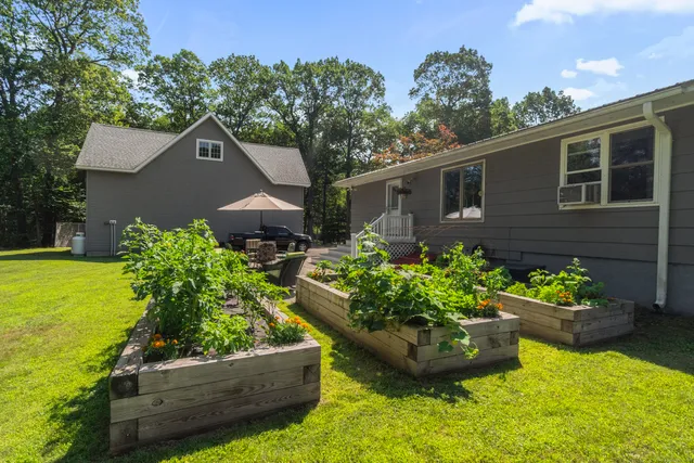 a backyard of a house with lots of green space
