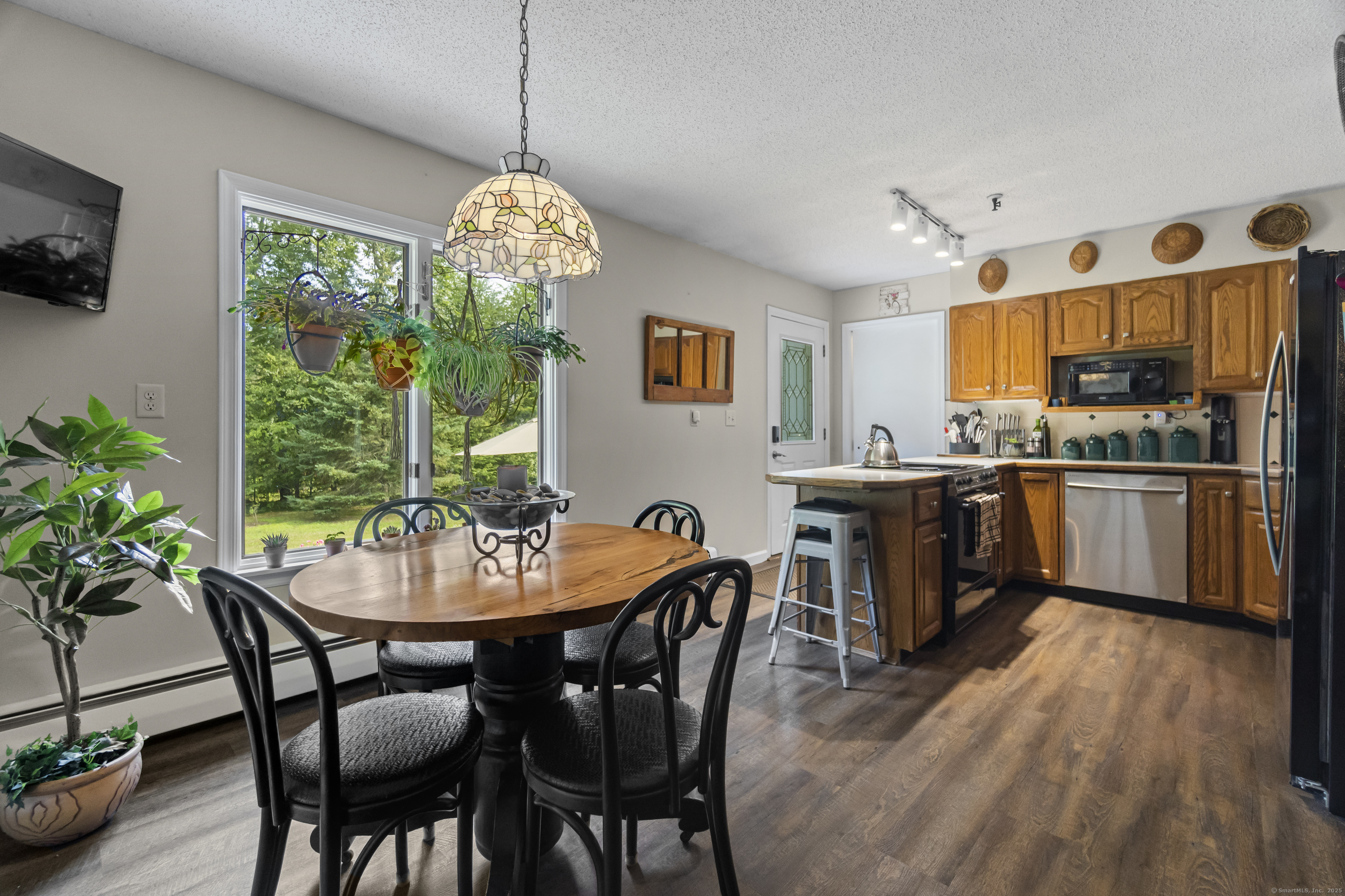 319 Main Street South Bethlehem, CT 06751 - Photo 8 of 33 a view of a dining room with furniture window and wooden floor