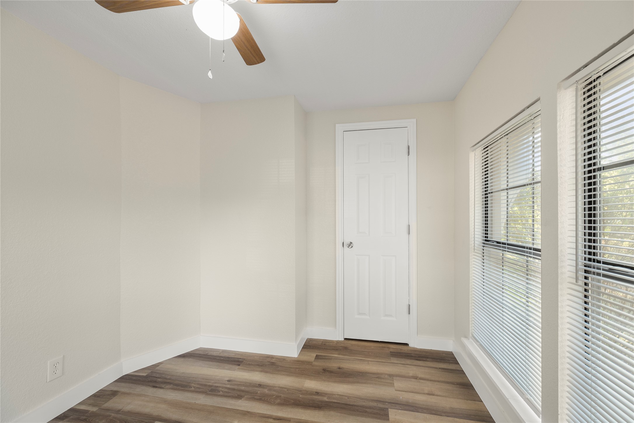 37111 Middle Trail, Unit 1 Magnolia, TX 77354 - Photo 13 of 32 a view of a room with wooden floor and windows