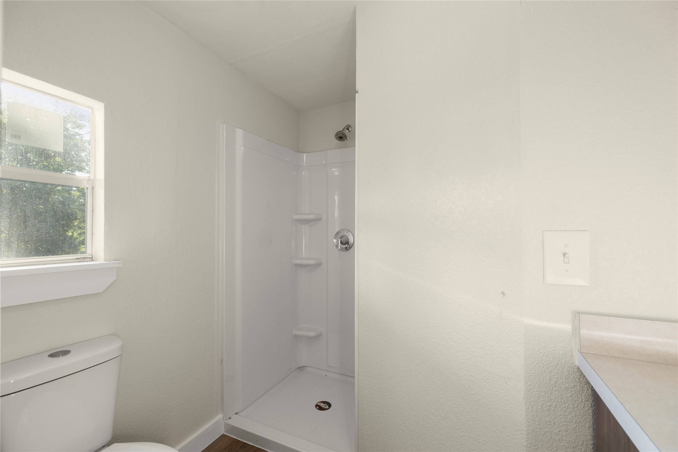 37111 Middle Trail, Unit 1 Magnolia, TX 77354 - Photo 17 of 32 a bathroom with a shower a toilet and sink