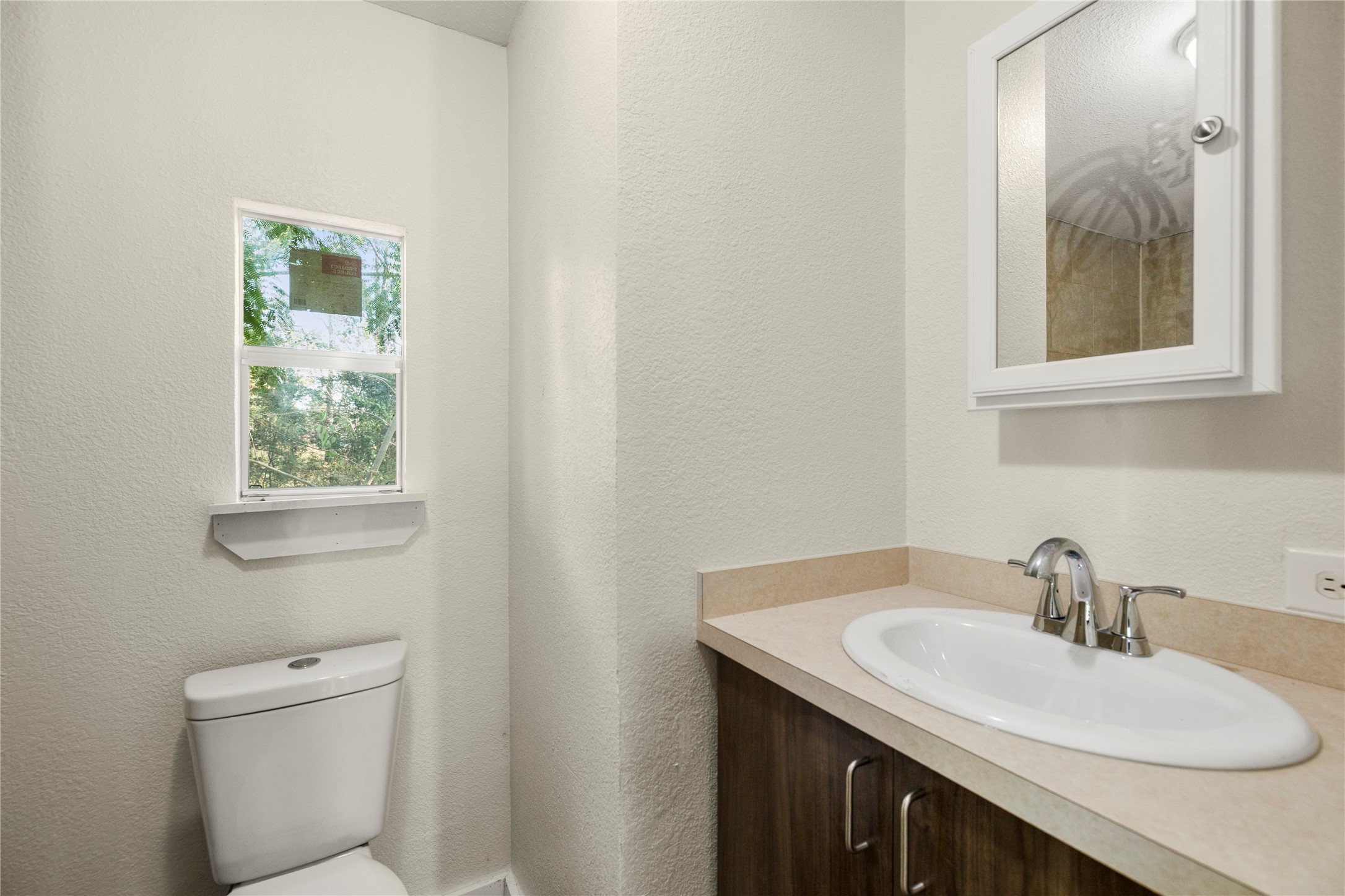 37111 Middle Trail, Unit 1 Magnolia, TX 77354 - Photo 21 of 32 a bathroom with a sink and a toilet