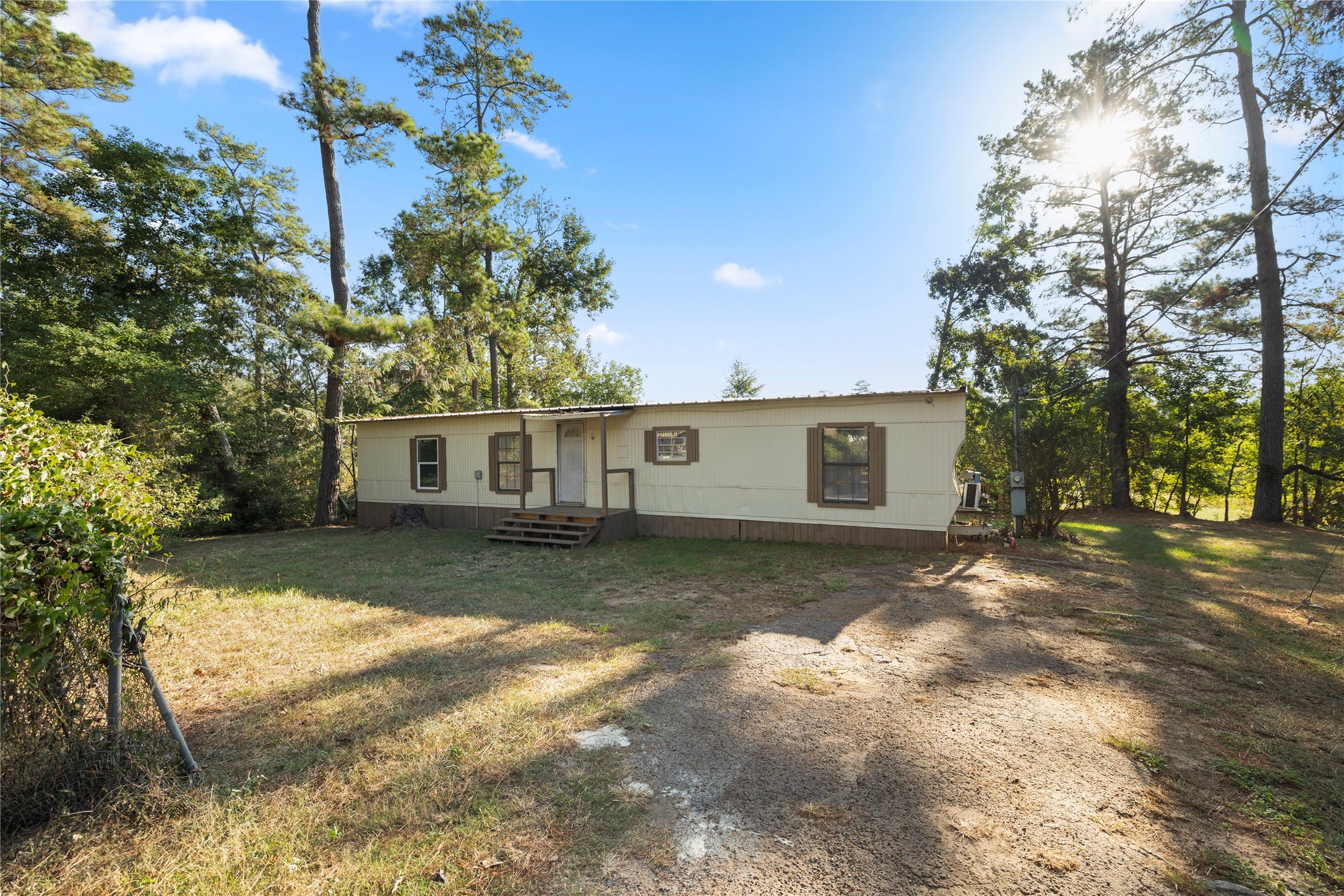 37111 Middle Trail, Unit 1 Magnolia, TX 77354 - Photo 27 of 32 a view of a yard with a house and a large tree