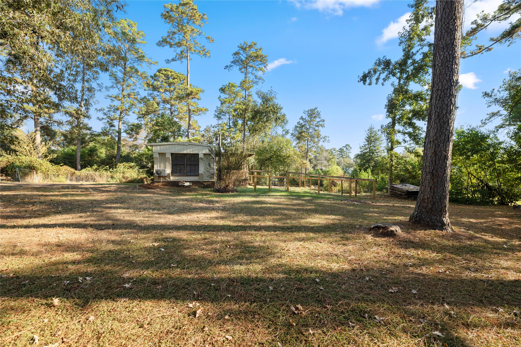 37111 Middle Trail, Unit 1 Magnolia, TX 77354 - Photo 31 of 32 a view of dirt field with large trees